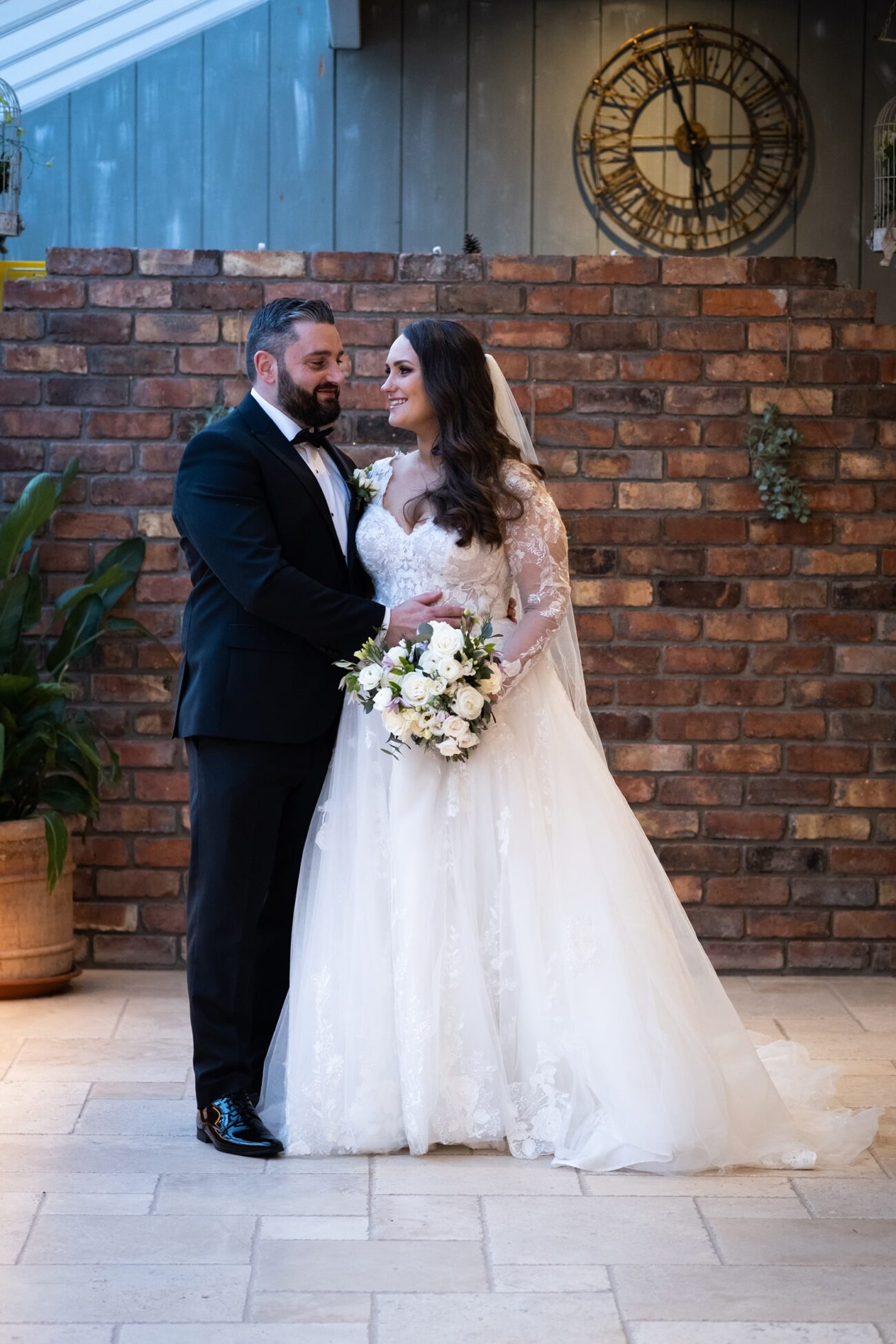 bride and groom close together and looking at each other in the manor house of Ballymagarvey Village