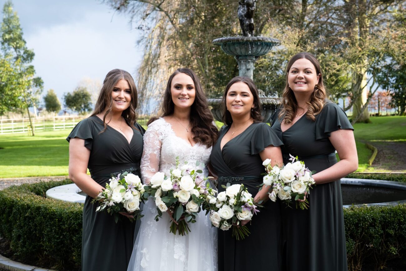 bridal party in the front courtyard of the manor house at Ballymagarvey Village