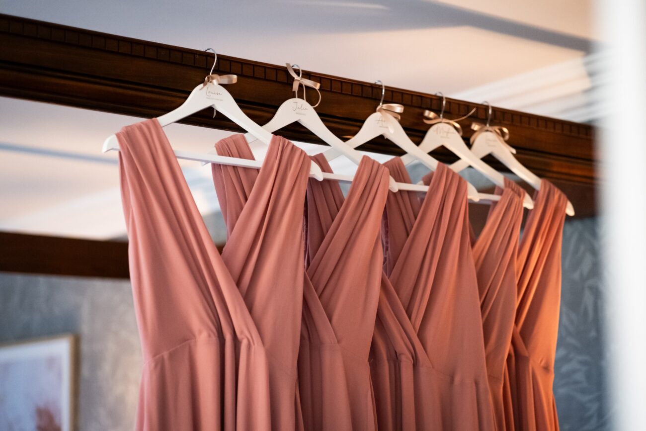 Bridemaids dresses hanging up on the bed in bridal suite of Killashee Hotel.