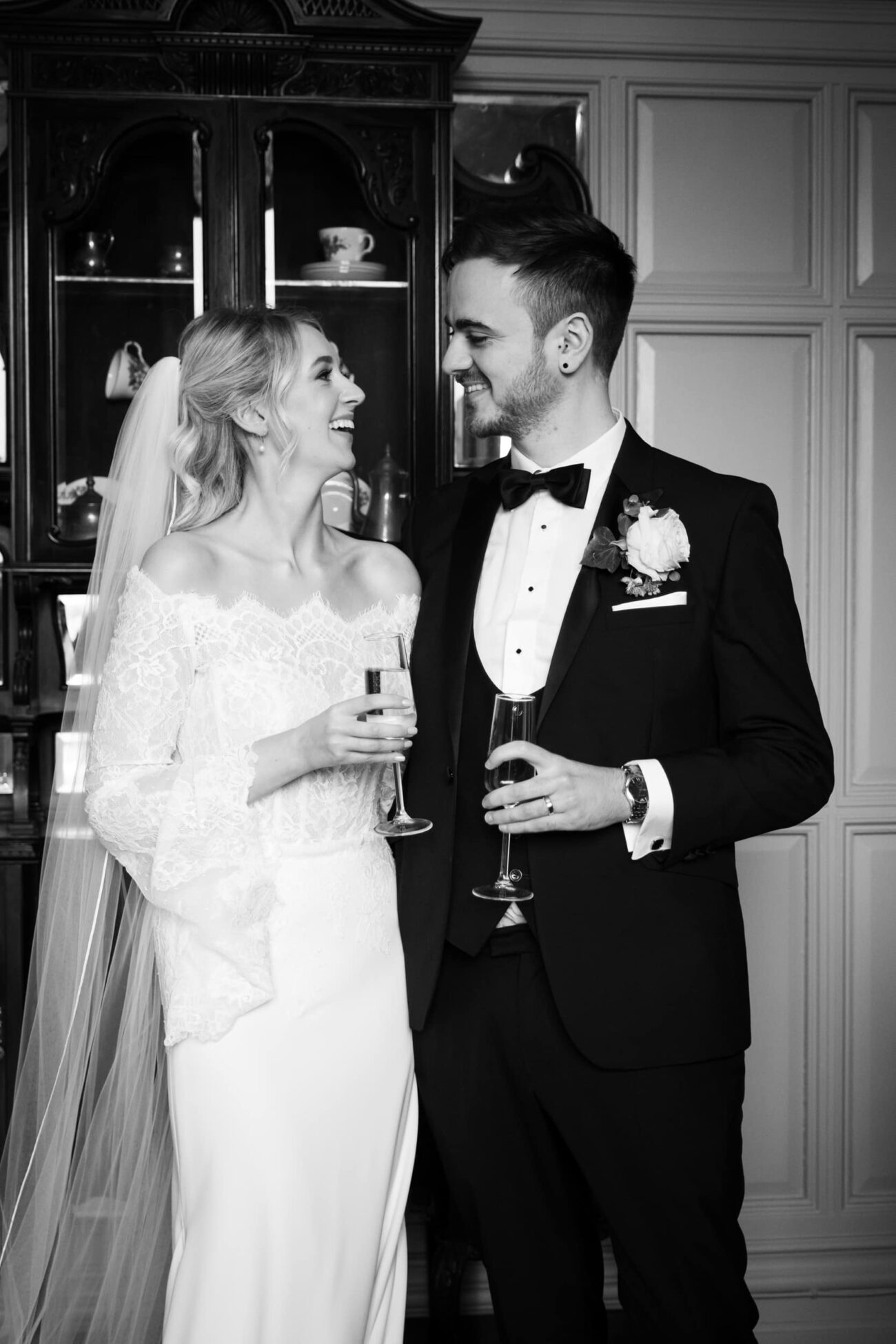 Bride and groom toasting in the hallways of Killashee Hotel wedding