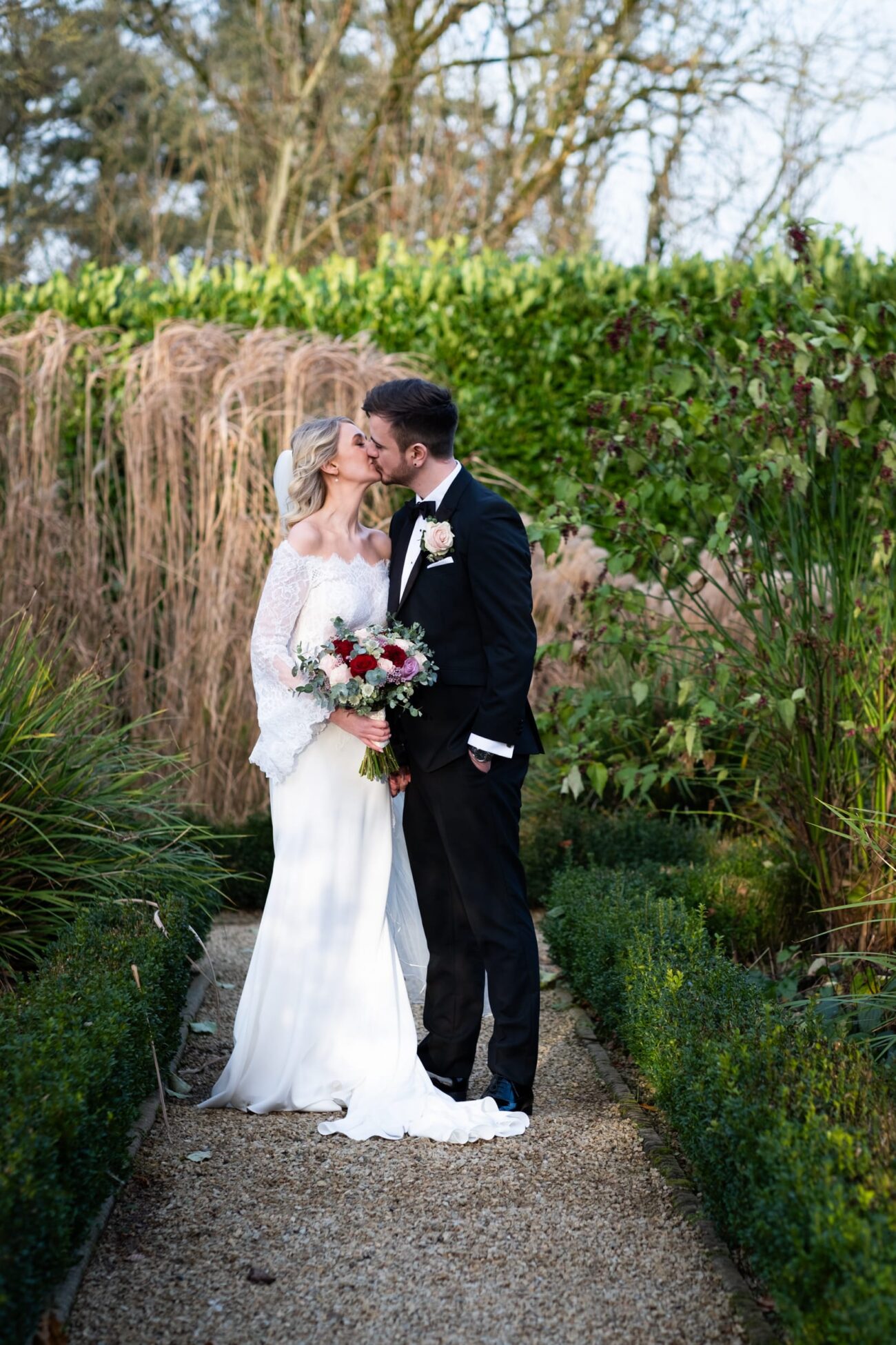 Bride and groom kissing in the butterfly garden at Killashee Hotel, Killashee Hotel wedding