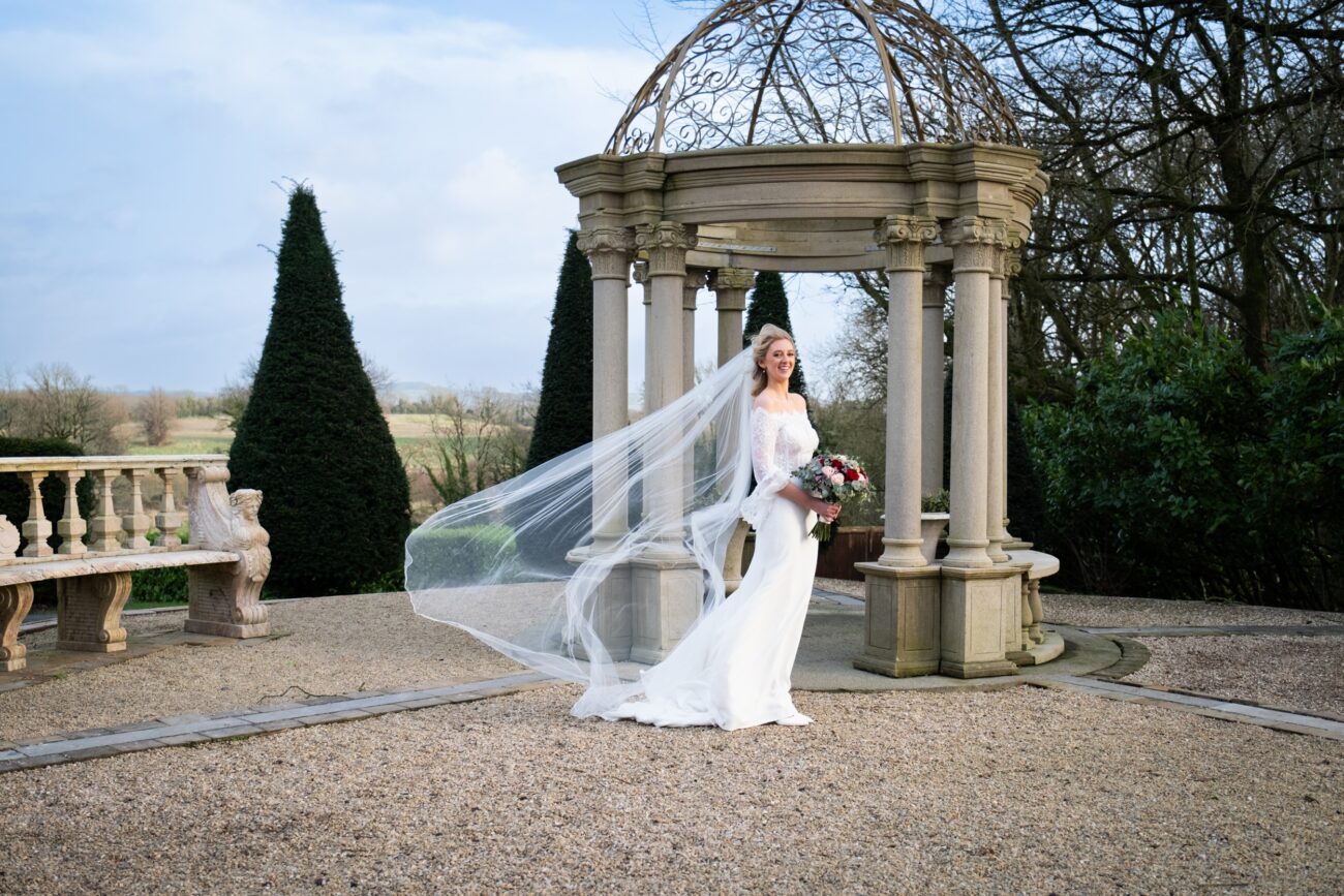 Bride Outside the front of the gazeebo in the butterfly garden at Killashee Hotel wedding