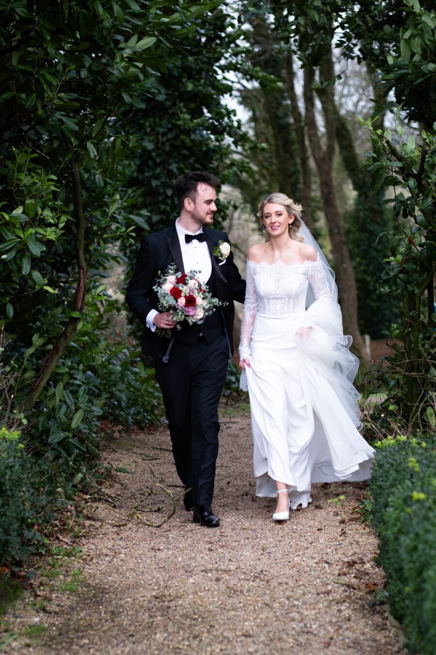 Bride and groom walking in the butterfly garden at Killashee Hotel, Killashee Hotel wedding