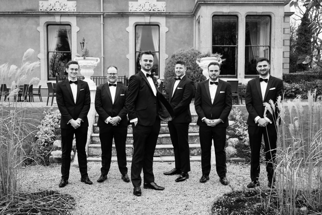 Groomsmen at the front of old house at Killashee Hotel