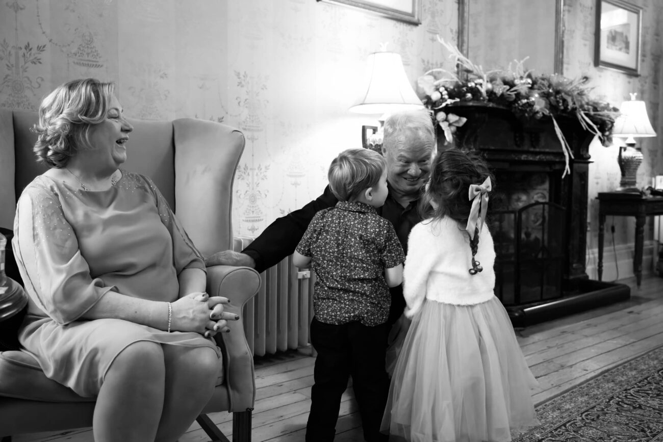 Guests talking to children in the Old House during cocktail hour at Killashee Hotel