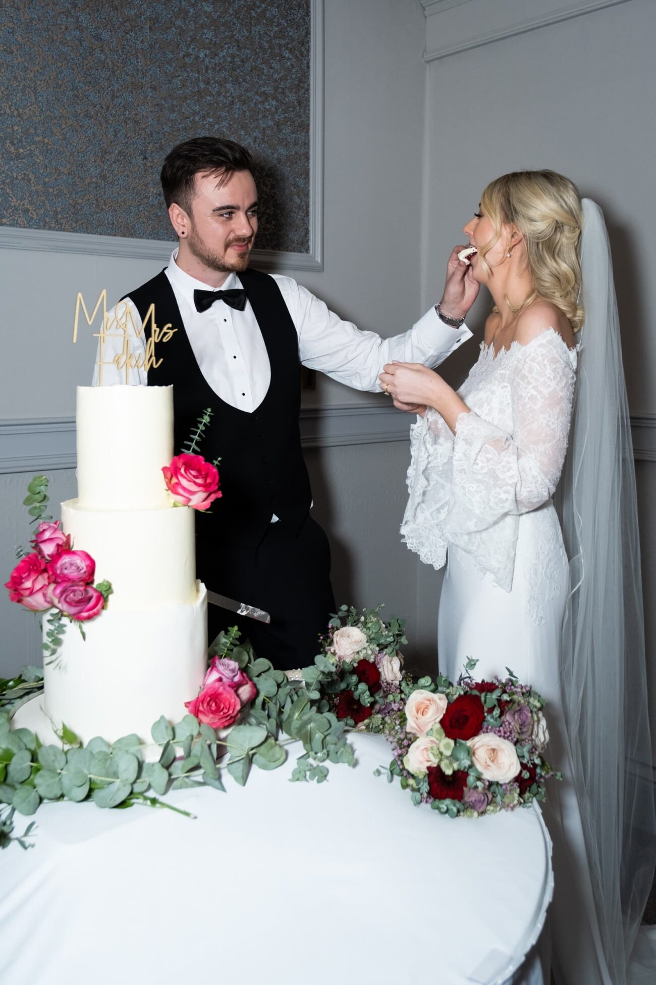 Bride and groom feeding each other cake during cake cutting at Killashee Hotel