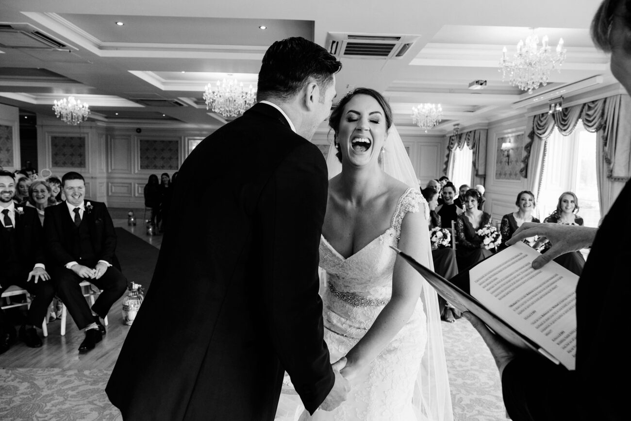 couple laughing during their ceremony at Crover house, candid wedding photography