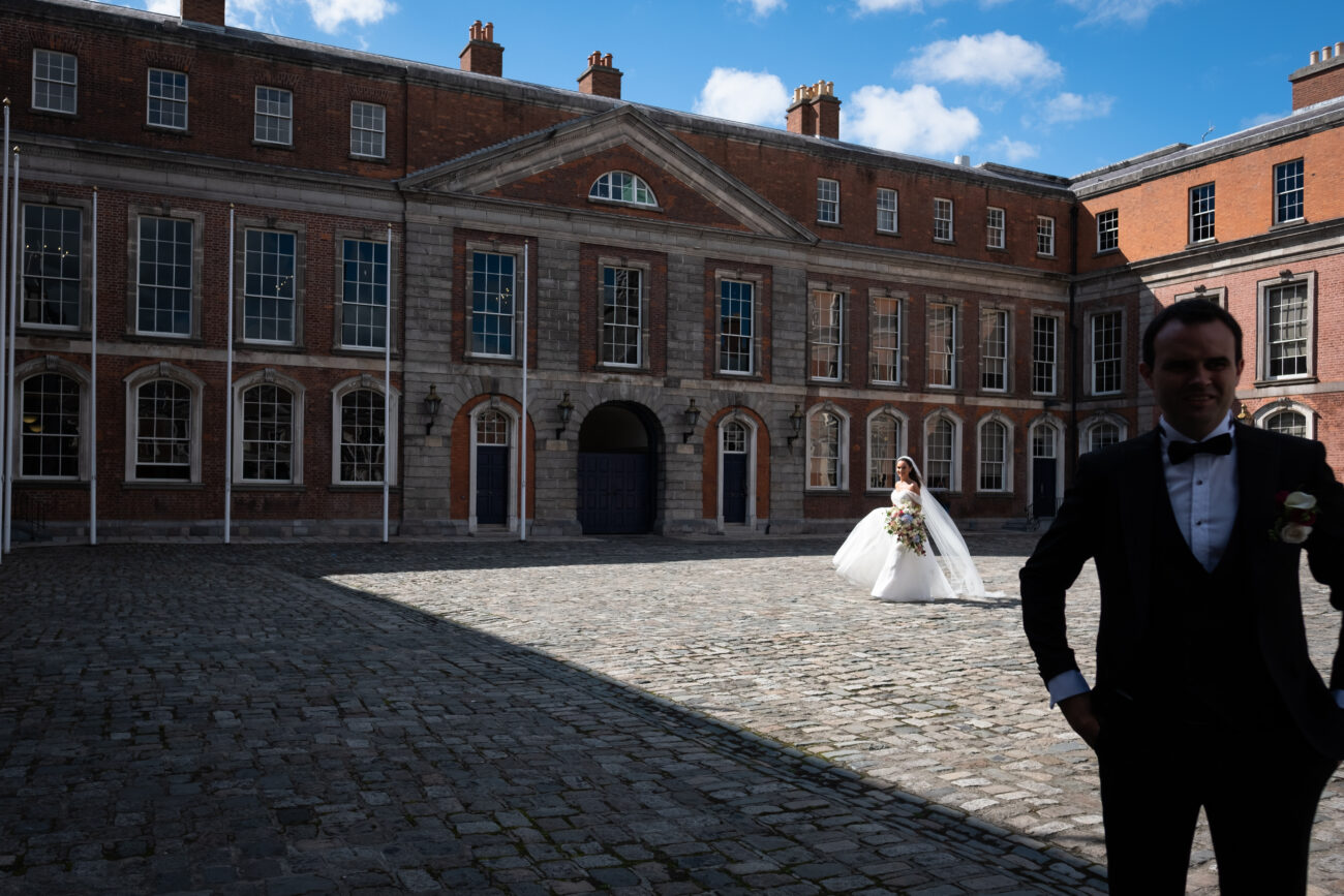 Bride walking up to her groom for a first look moment in Dublin Castle, Vow renewal in Dublin