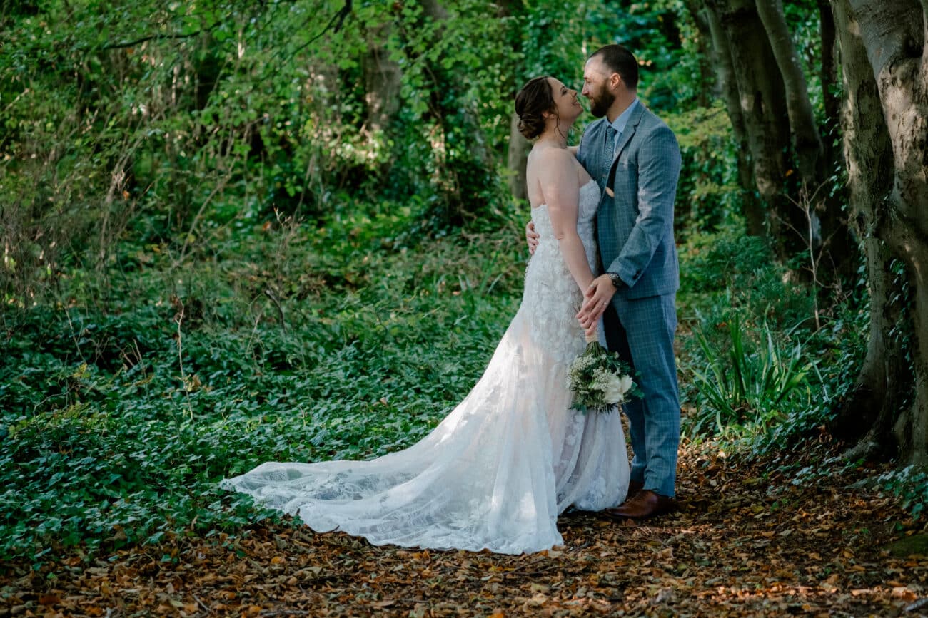 couple kissing in the forrest setting of Howth Castle. Elopement in Howth