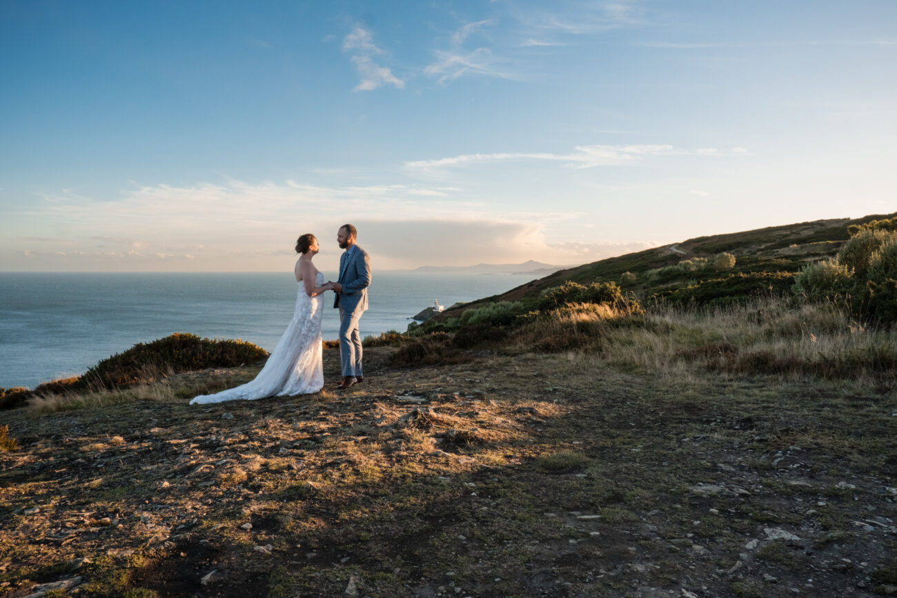 Vow renewal in Dublin, vow renewal Howth, couple standing on Cliffs of Howth renewing their vows