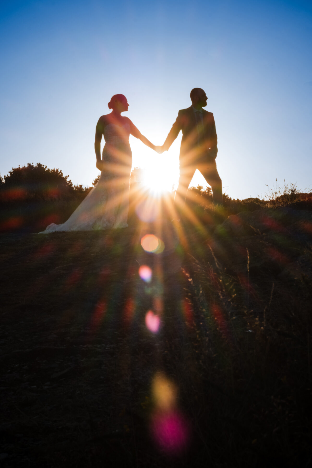 silhouette of couple in the sunset at The Cliffs of Howth