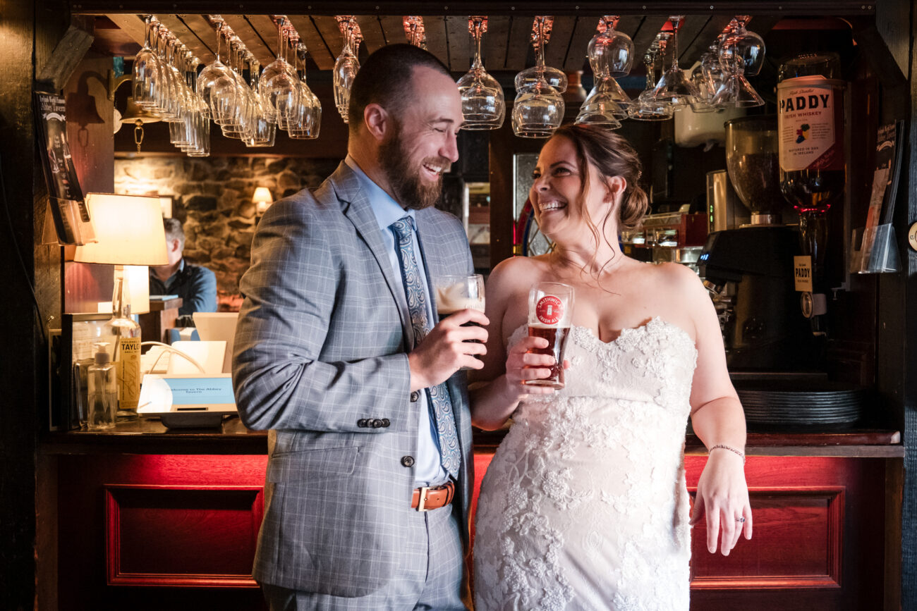 couple toasting a drin at the bar in The Abbey Tavern