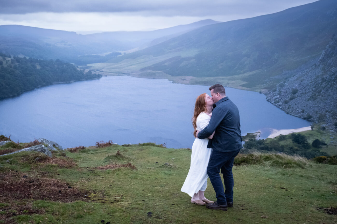 Engagement photography in Lough Tay, Couple kissing at Lough Tay