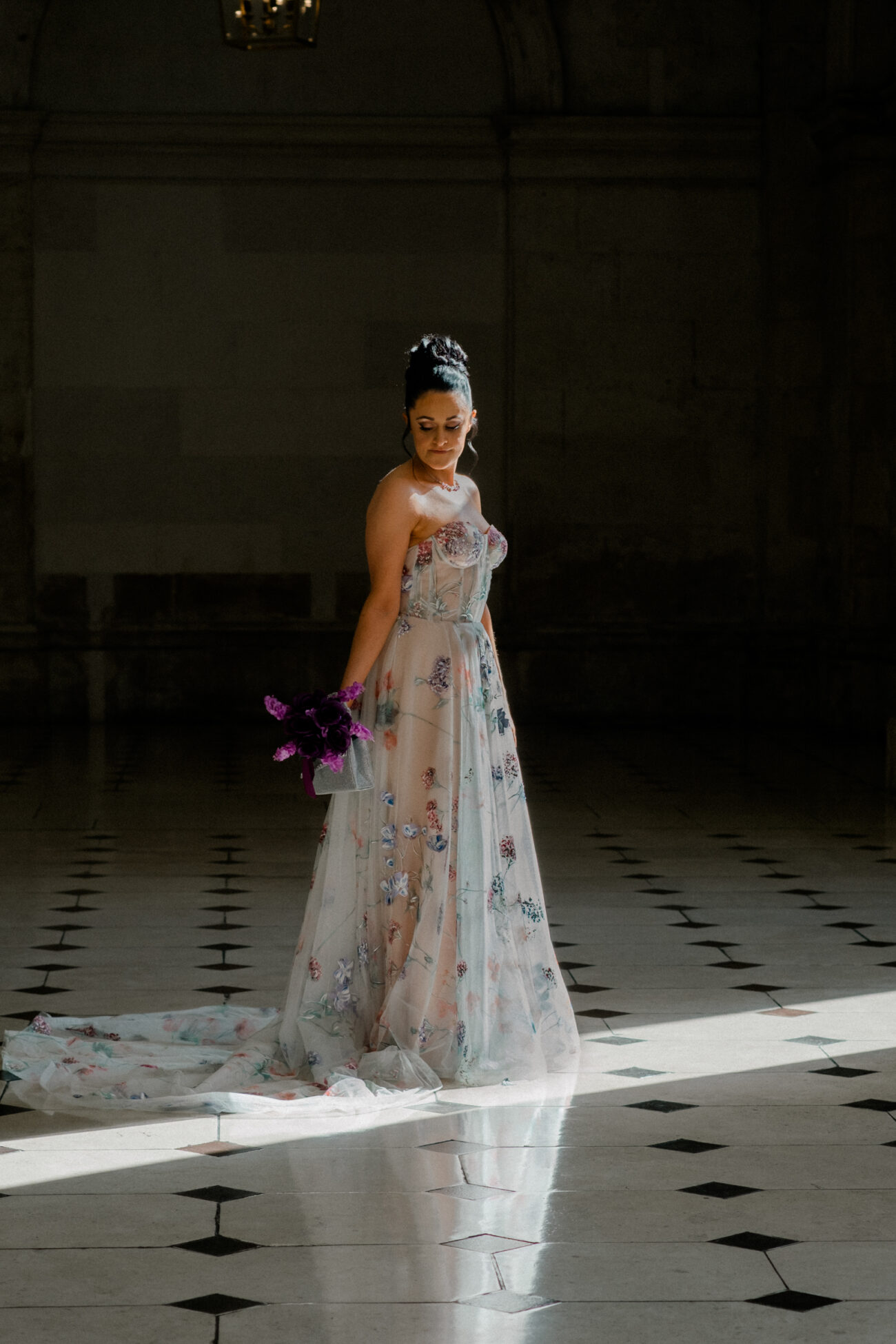 Bride standing in the sunlight in Dublin City Hall