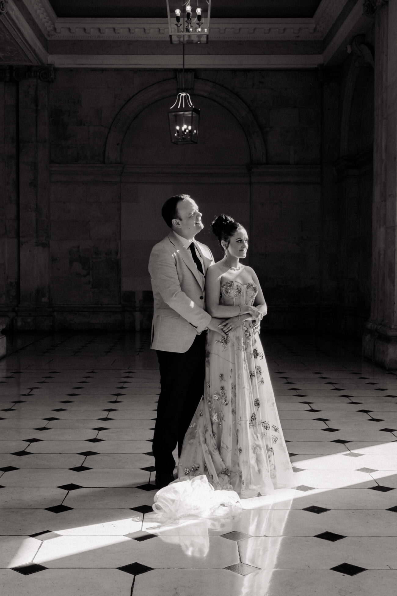 Couple standing and facing the sunlight in Dublin City Hall