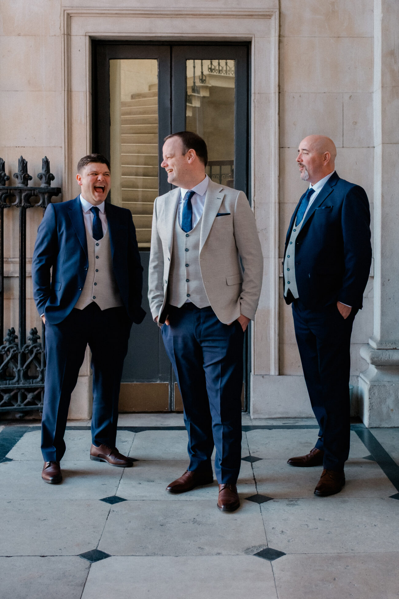 Groom standing with his groomsmen outside Dublin City Hall