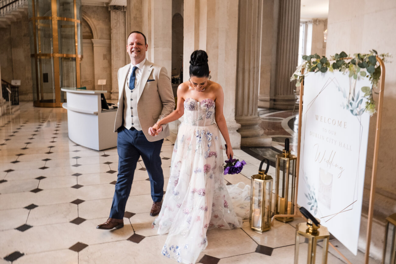 couple walking down the aisle at City Hall Dublin. Dublin City Hall wedding