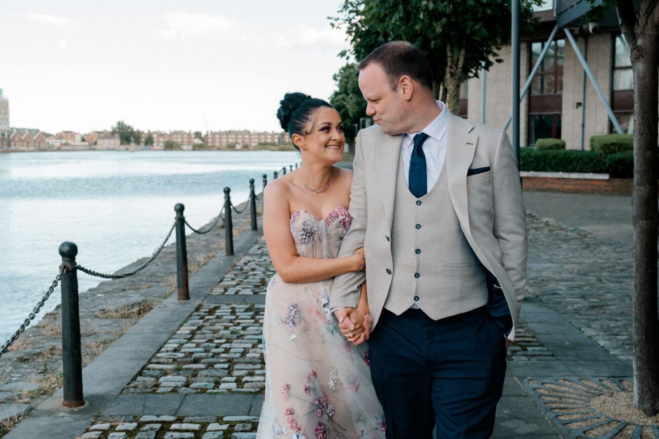 couple walking arm in arm at Docklands, Charlotte Quay wedding