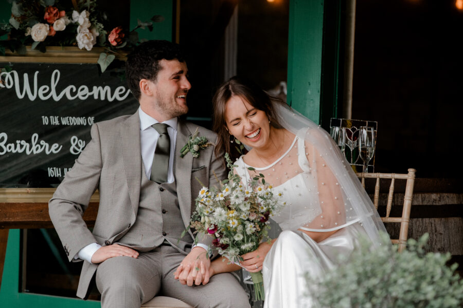 couple laughing at the speeches at Ballintubbert House, candid photography