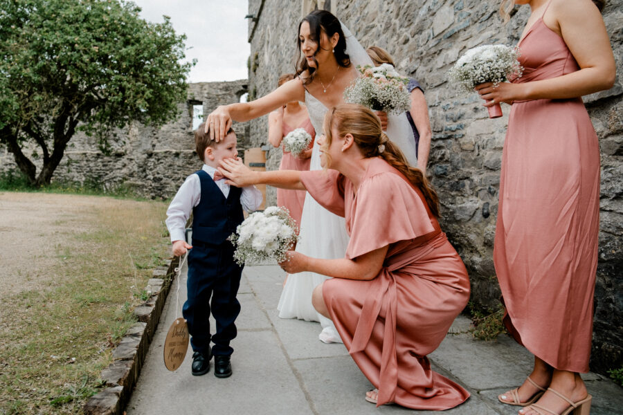 bridal party fixing page boys face