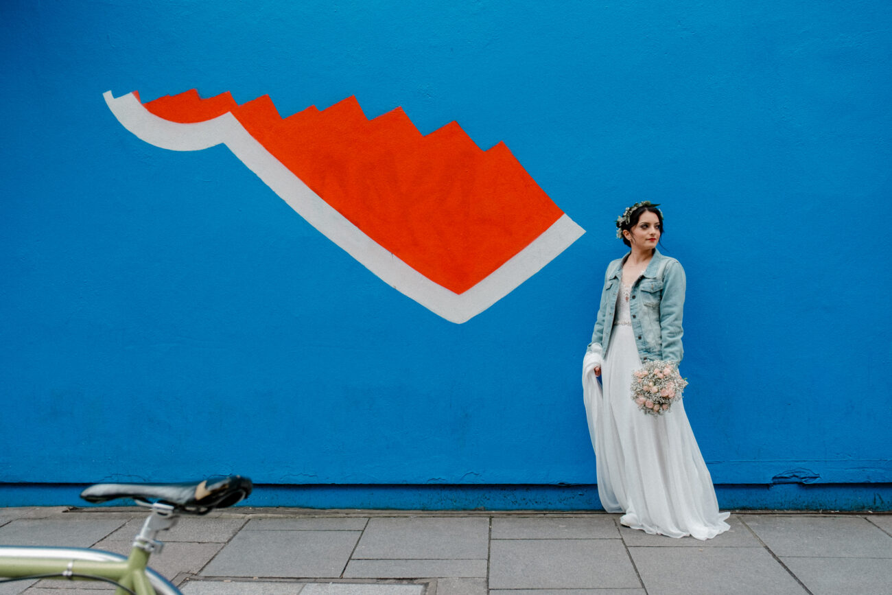 portrait of a bride next to graffiti in Temple Bar. Dublin elopement