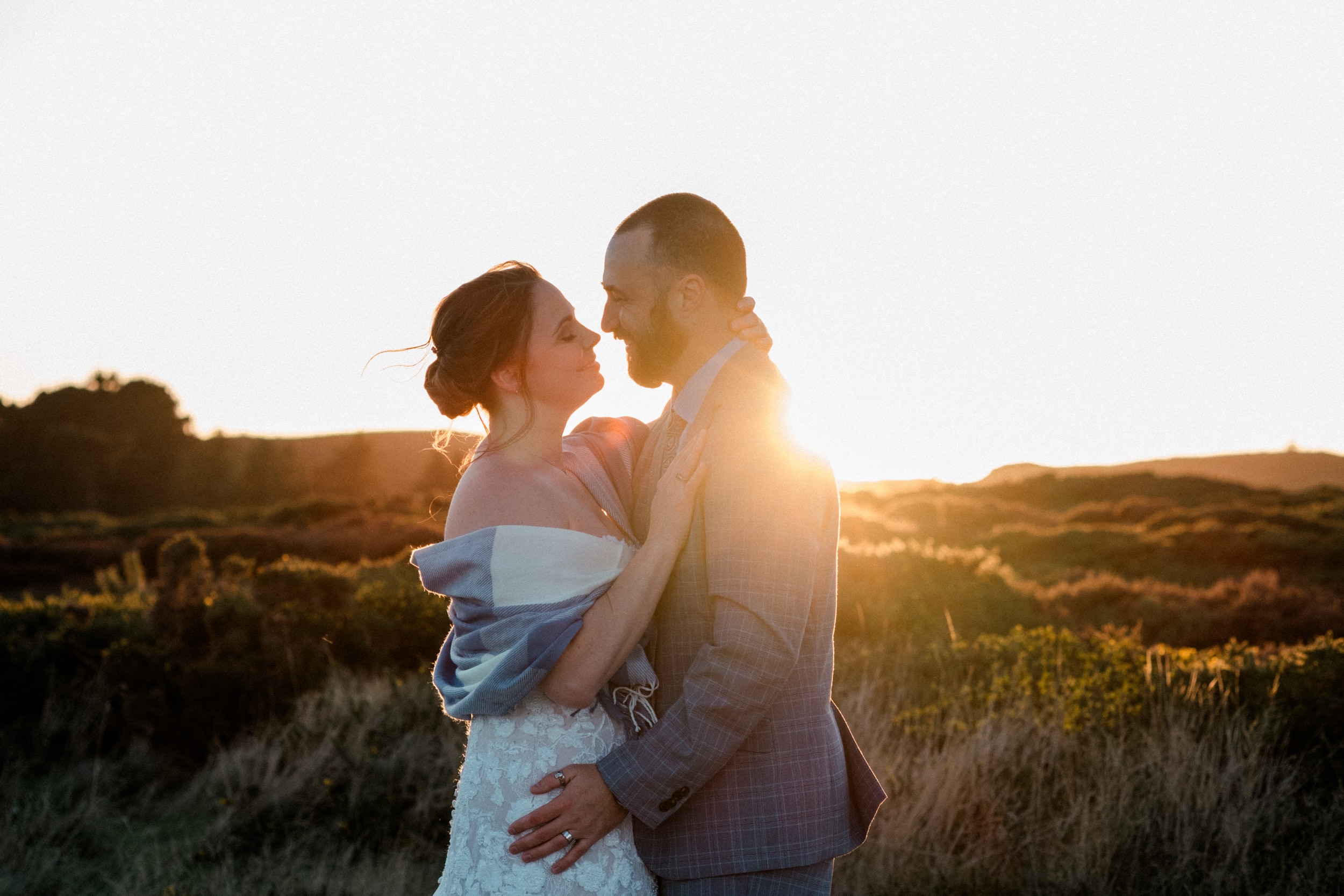Vow renewal in Dublin on Howth summit, couple kissing against the sunset, wedding photographer Dublin, vow renewal in Howth
