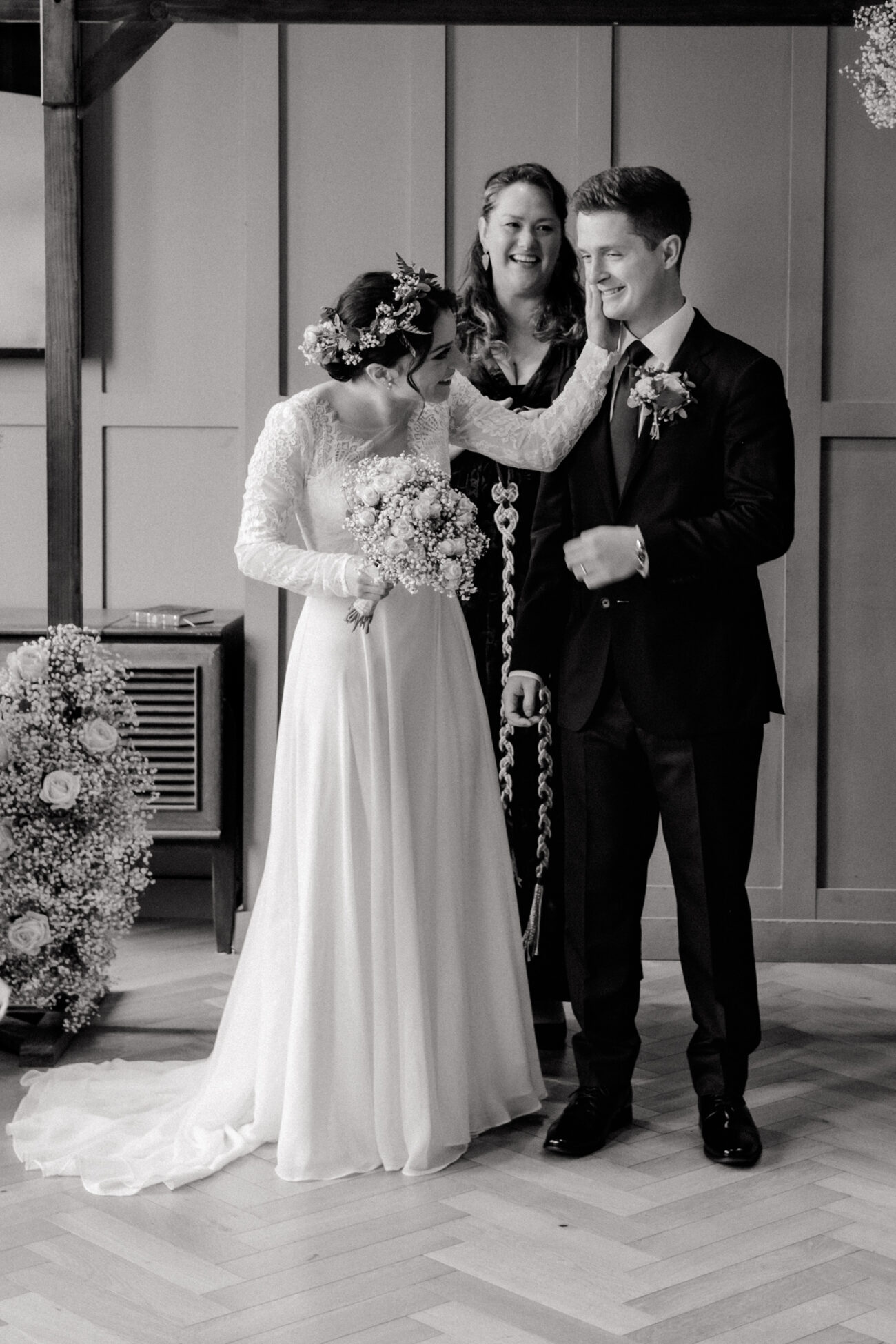 bride wiping lipstick off grooms face after first kiss at The Clarence Hotel. Clarence hotel wedding, Dublin Elopement