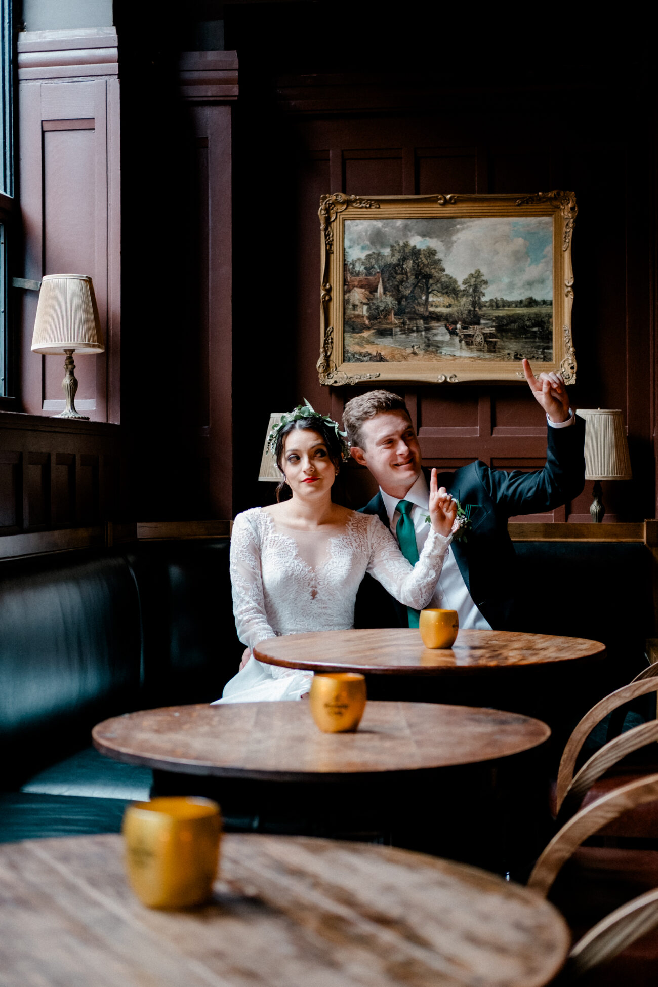 couple pretending to order at pint at the bar at The Clarence Hotel