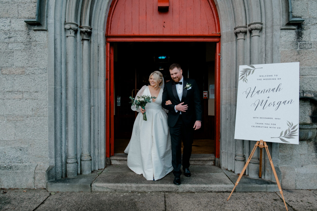 bride and groom walking out of the church. Candid wedding photography