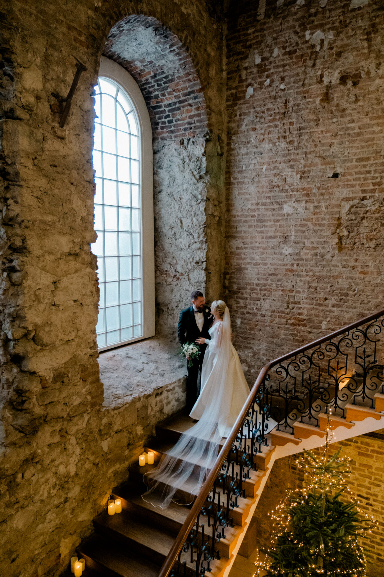 portrait of the bride and groom at the large window in Powerscourt House, wedding at Powerscourt Estate