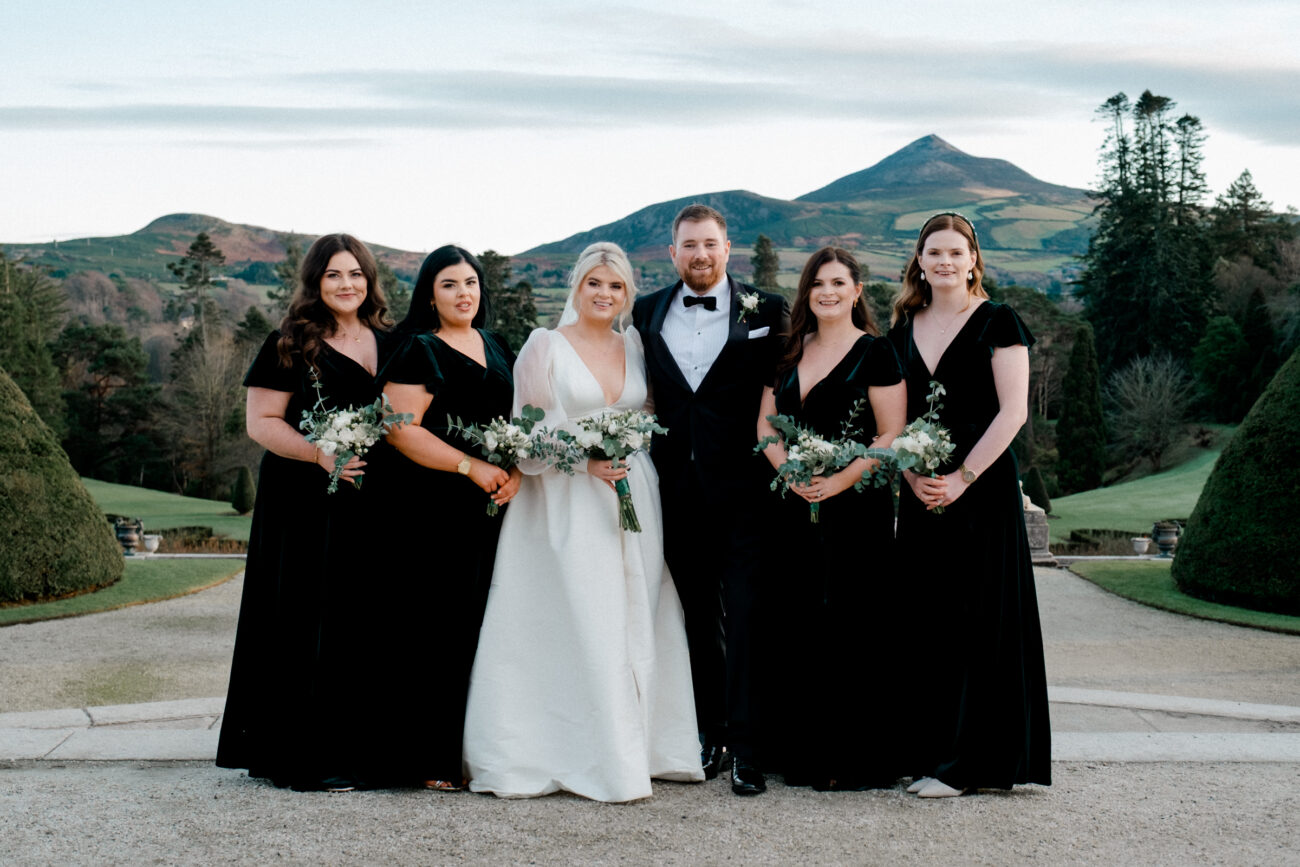 family photograph in front of the Sugarloaf mountains. Wedding at Powerscourt estate