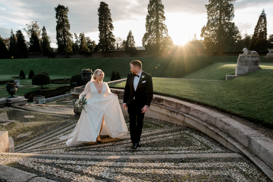 couple walking up the steps outside the front of Powerscourt Gardens and Estate