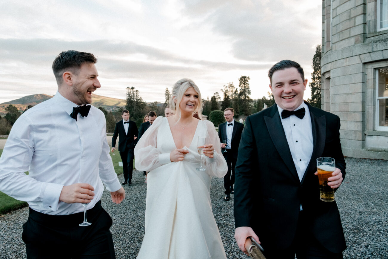 Bride laughing with guests at Powerscourt House