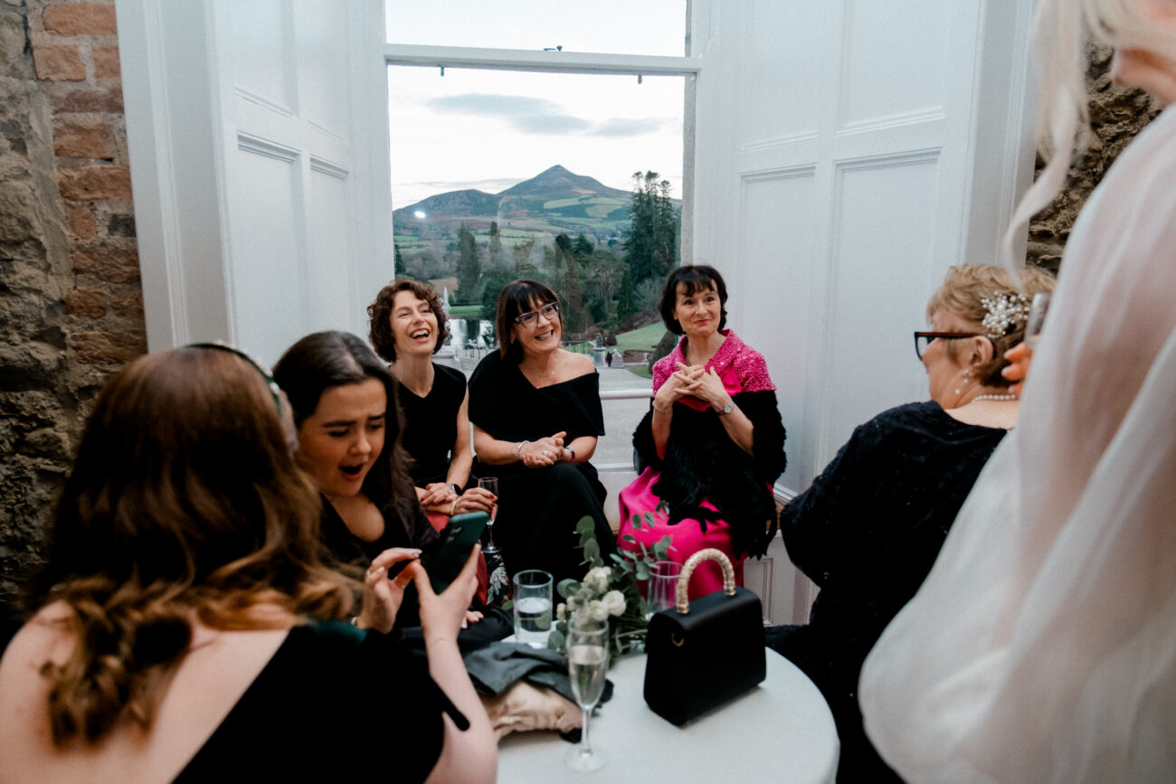 guests laughing with each other at Powerscourt House