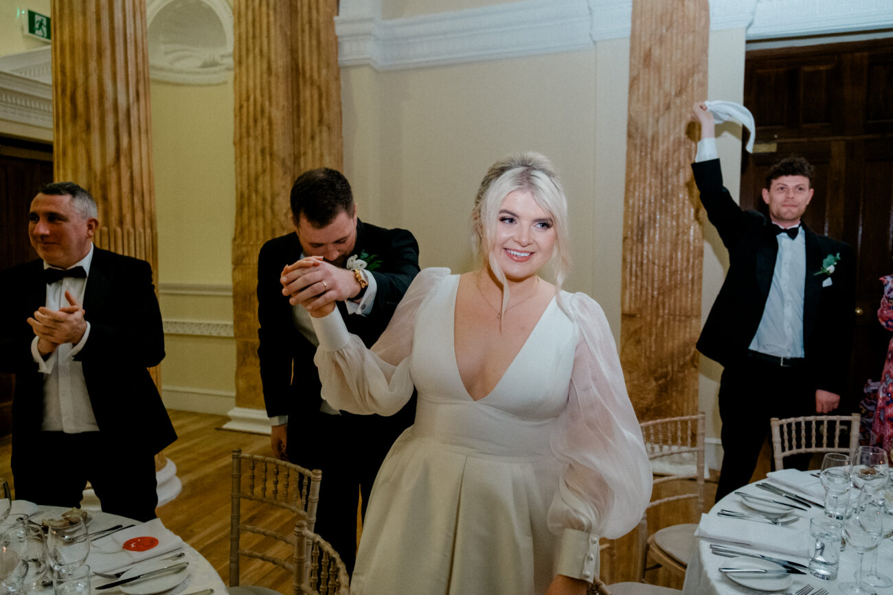 Couple coming into dinner room at Powerscourt Estate, candid wedding photography
