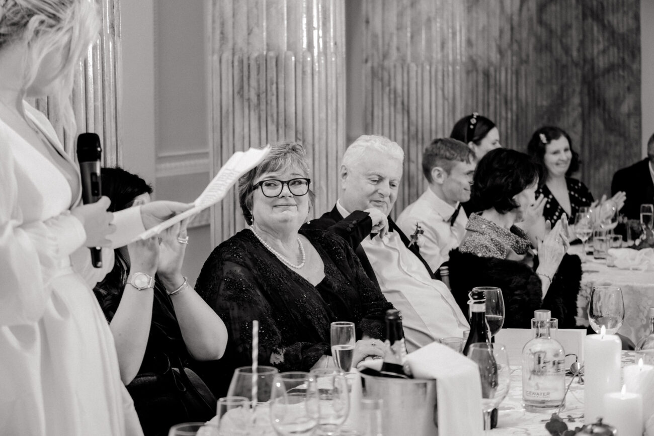 mother looking loveingly at her daugheters speeches at Powerscourt Estate and Gardens, candid wedding photography