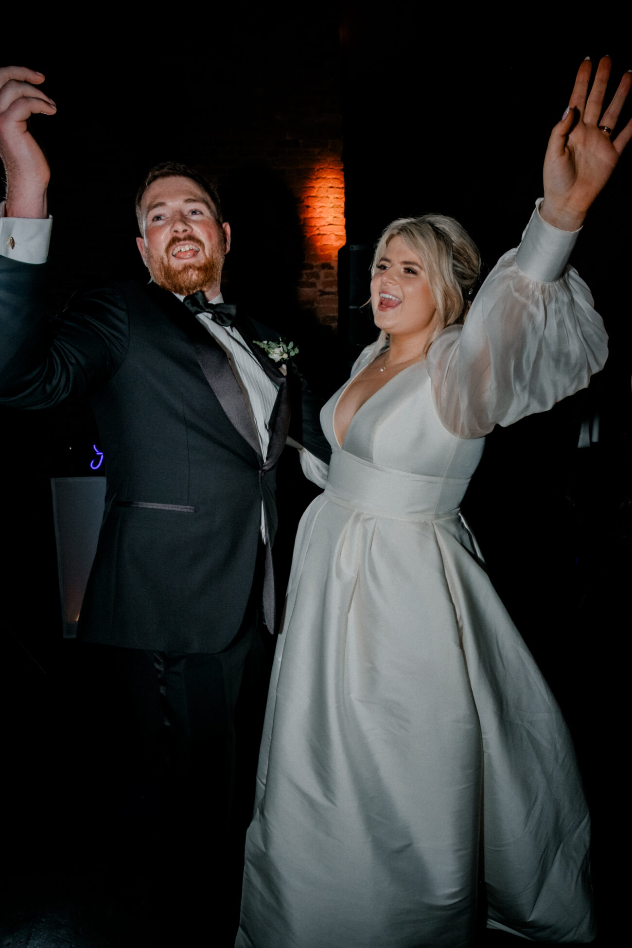 bride and groom dancing together and singing during first dance at Powerscourt Estate. Candid wedding photographer in Dublin
