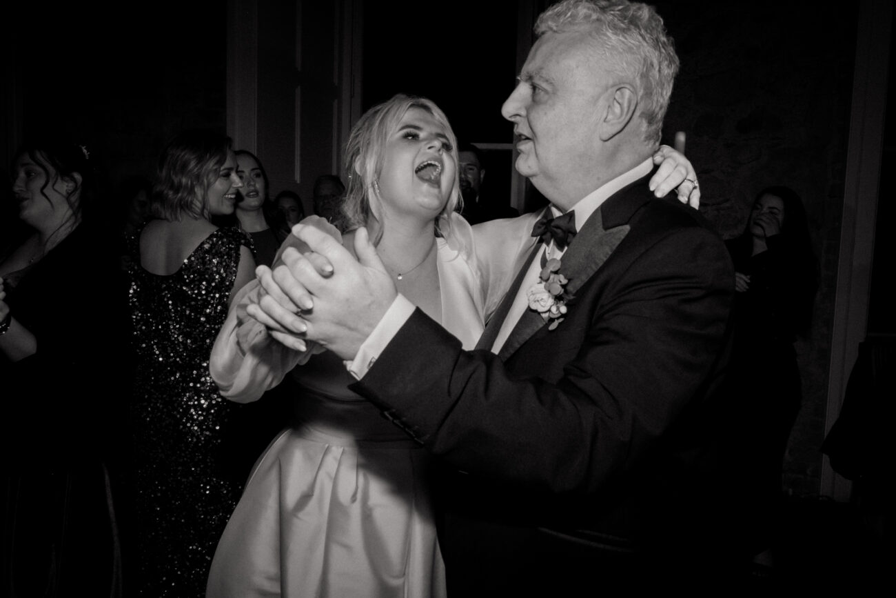 bride dancing with her father, candid wedding photography