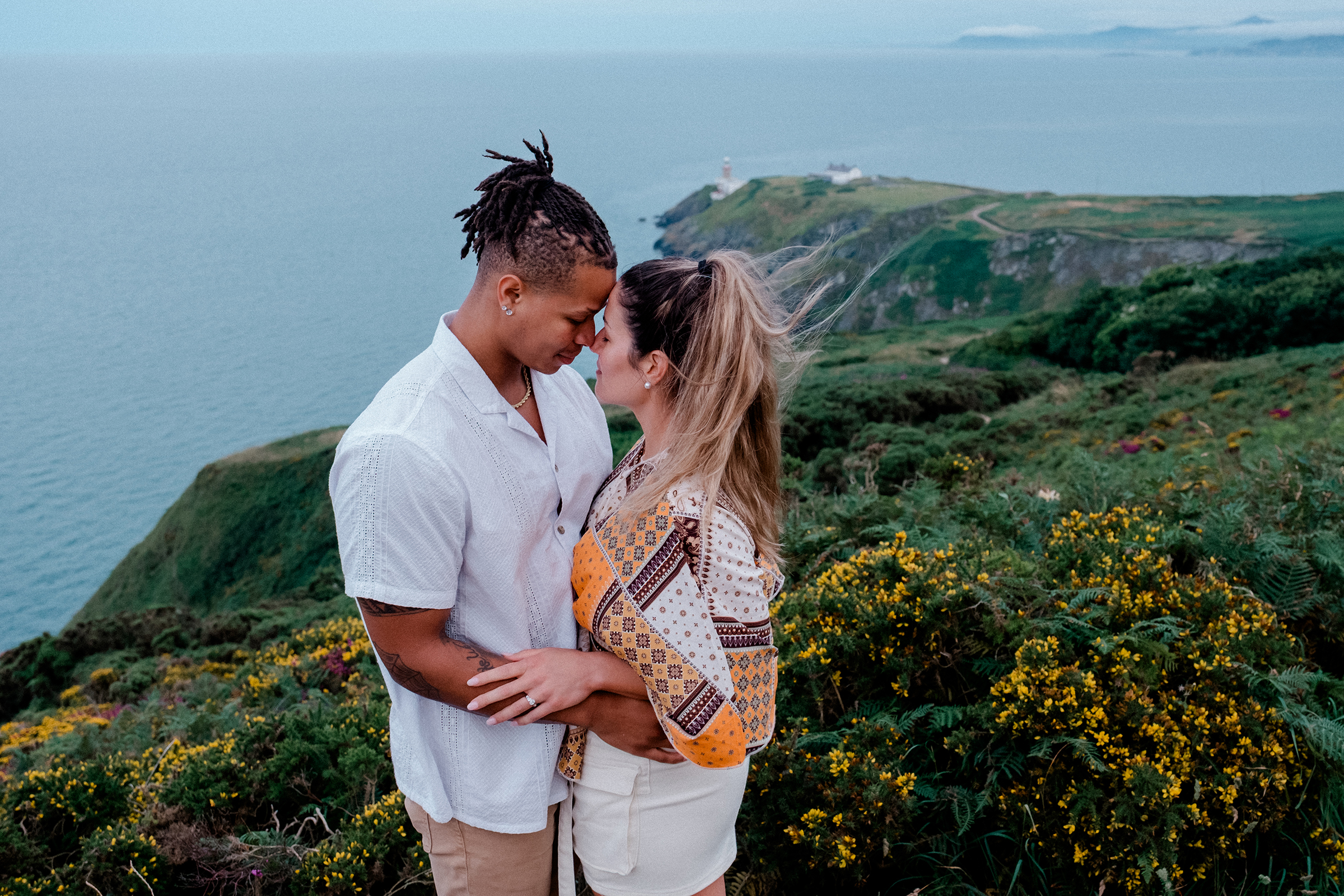 couple embracing at an engagement shoot on Howth Summit