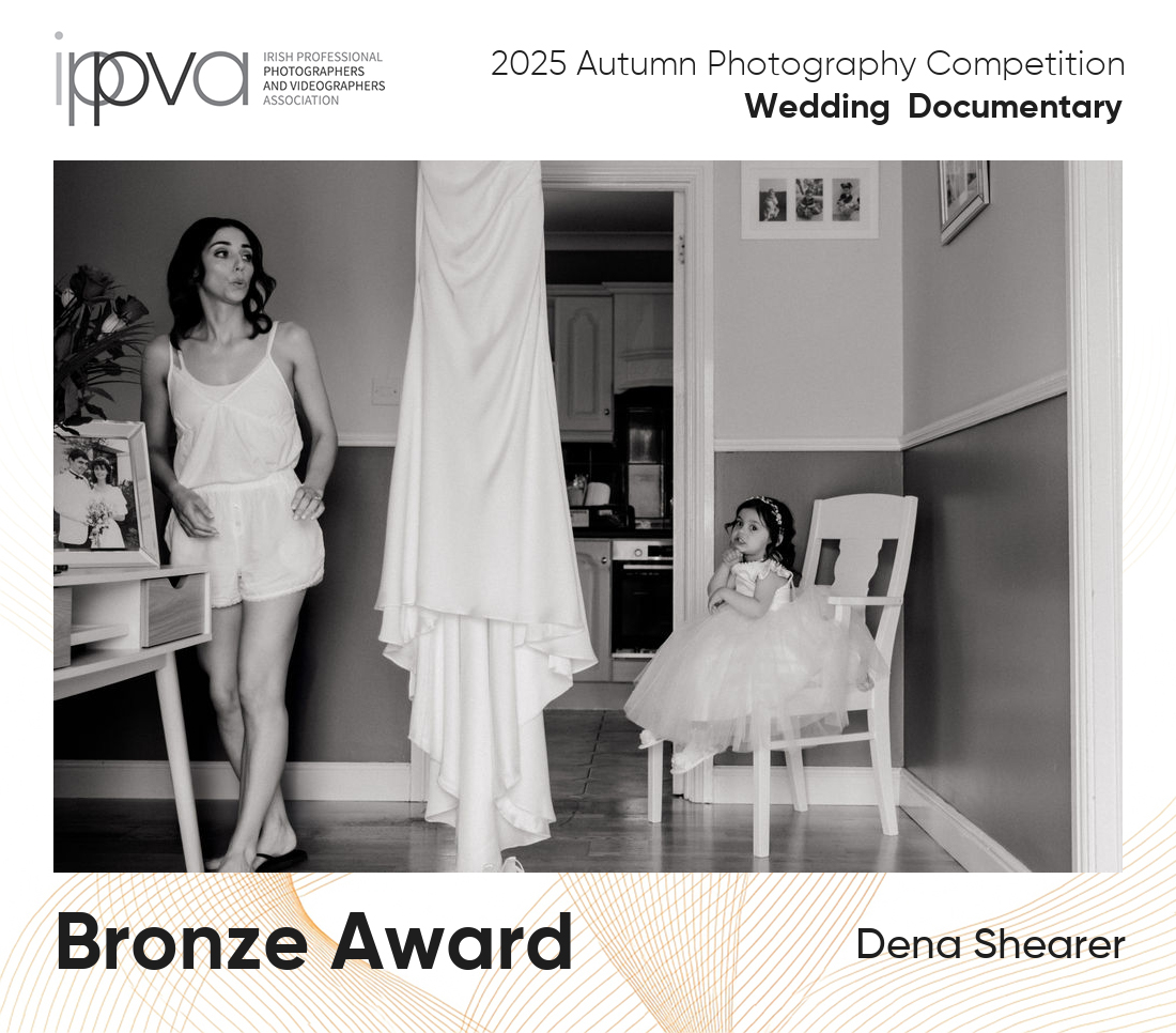 Candid wedding photo of flower girl and bride at her dress