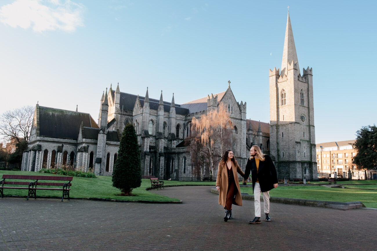 Couple walking the grounds on St Patricks Cathedral in Dublin