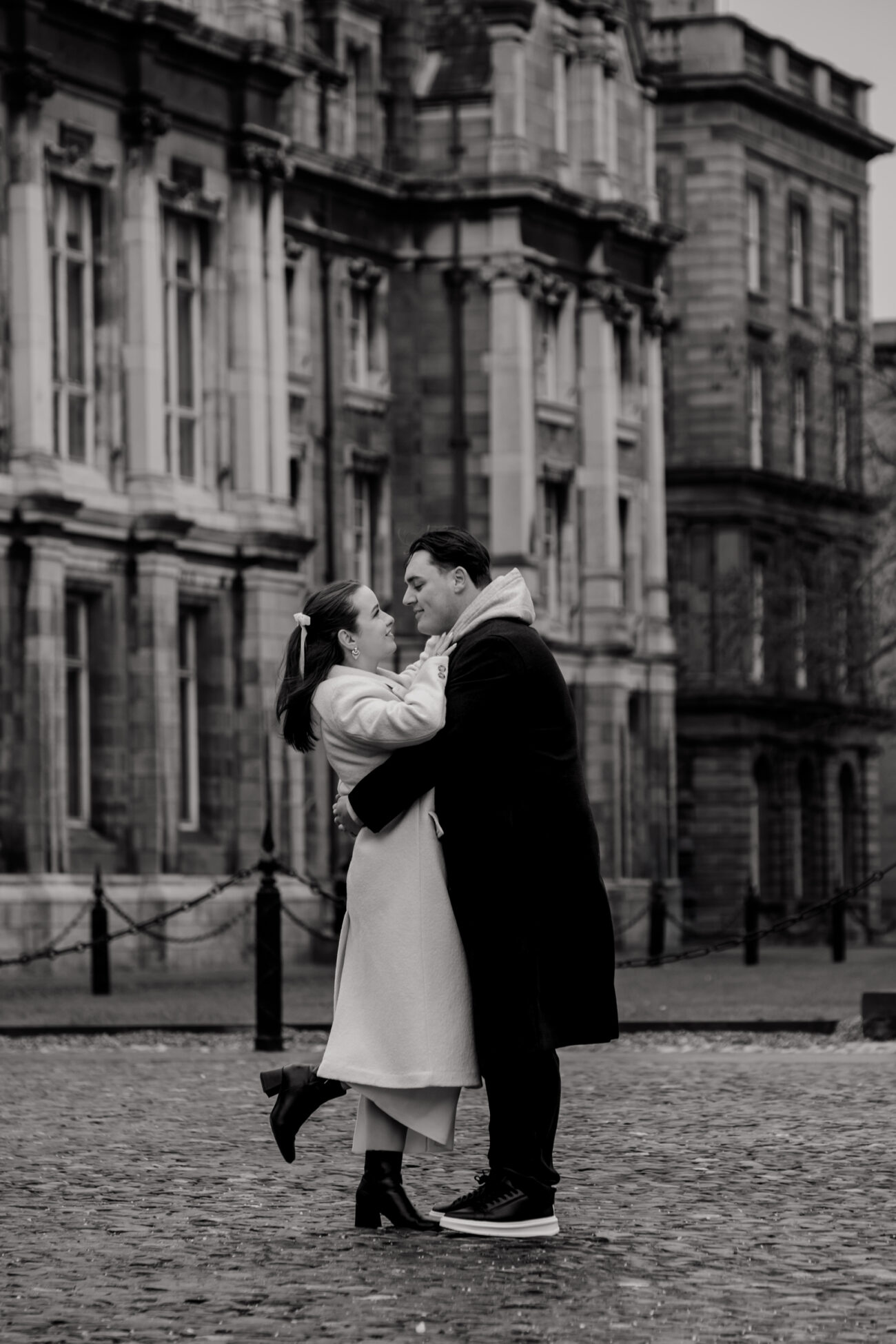 Couple hugging on the grounds of Trinity College