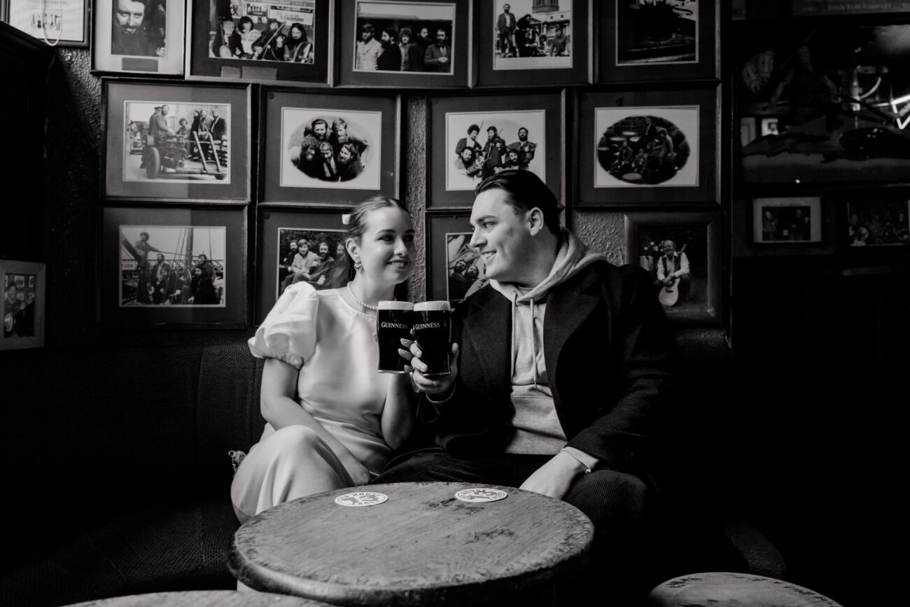 Couple drinking Guinness in O'Donoghues Pub in Dublin