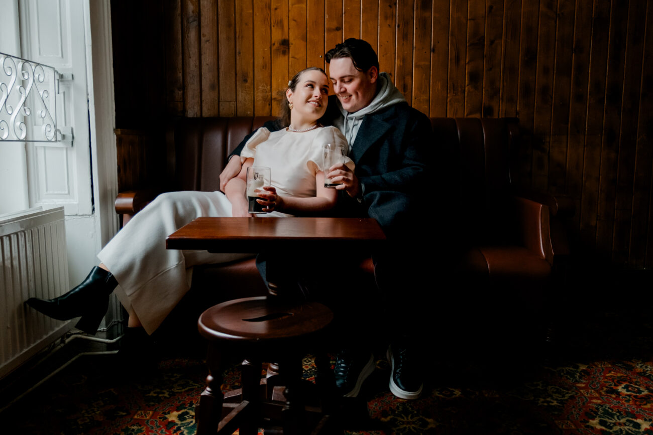 Couple drinking Guinness in O'Donoghues Pub in Dublin