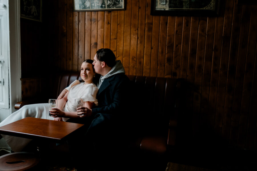 Couple drinking Guinness in O'Donoghues Pub in Dublin