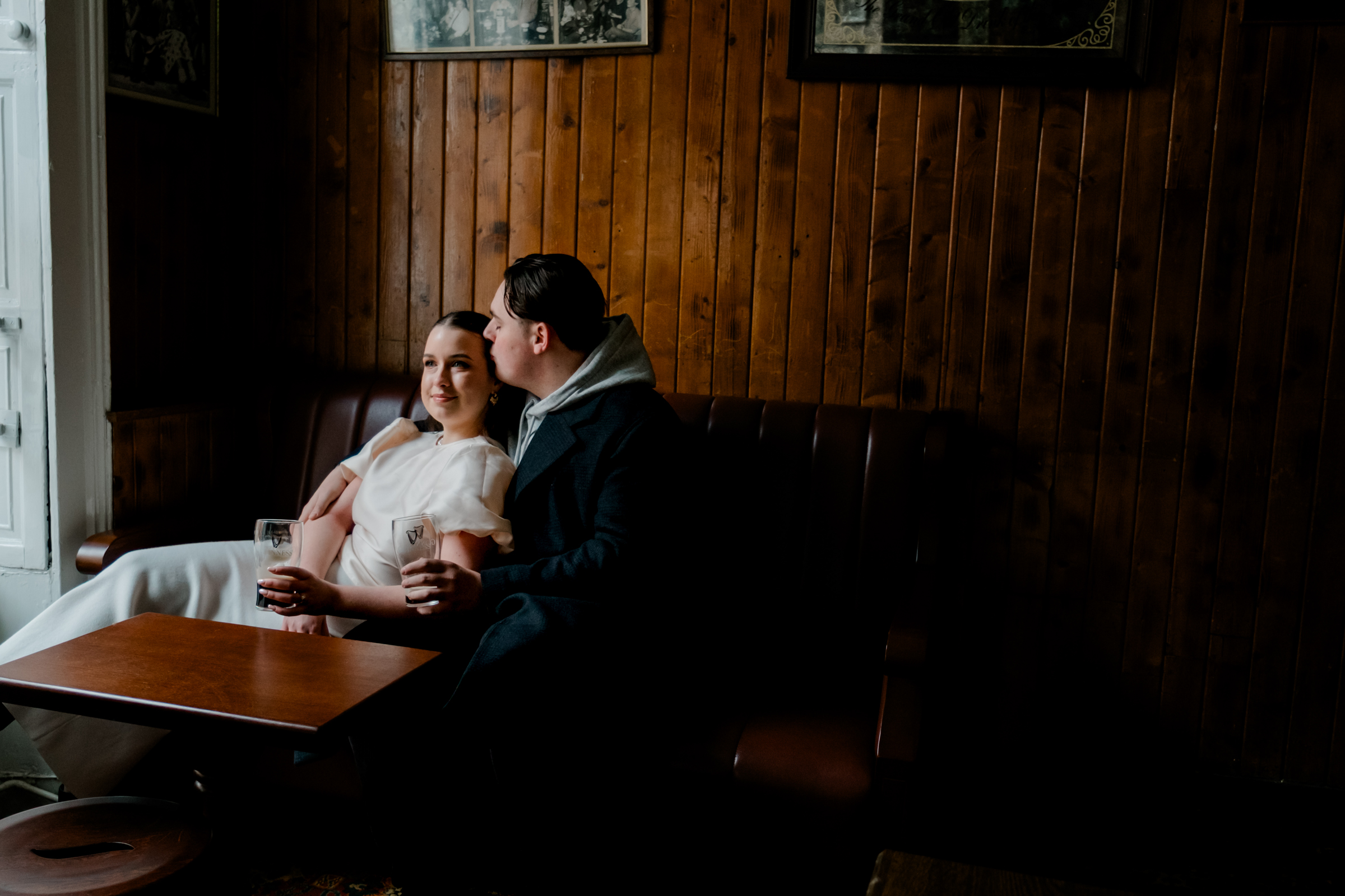 Couple drinking Guinness in O'Donoghues Pub in Dublin
