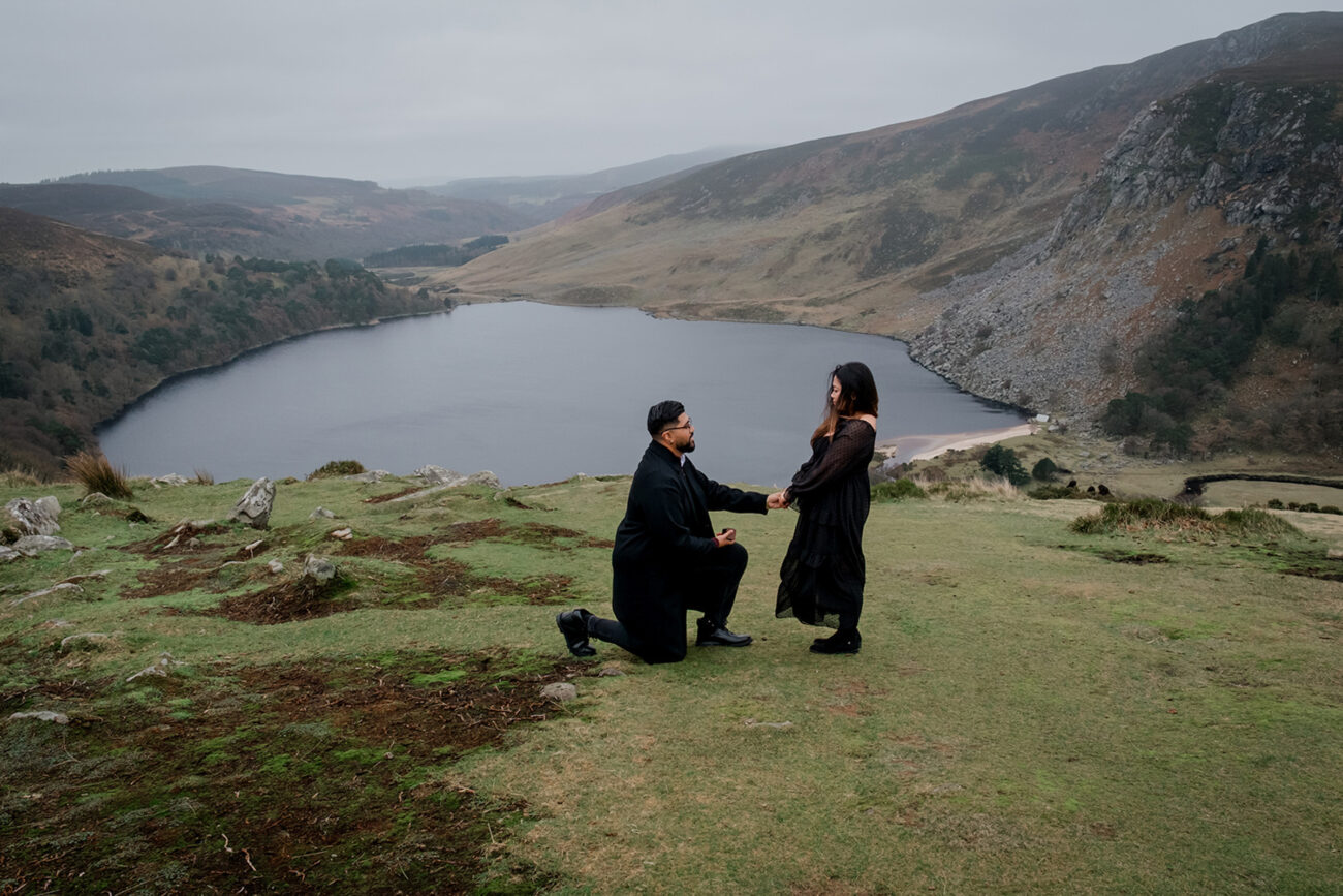 man down on one knee proposing in Lough Tay, secret proposal shoot in Lough Tay