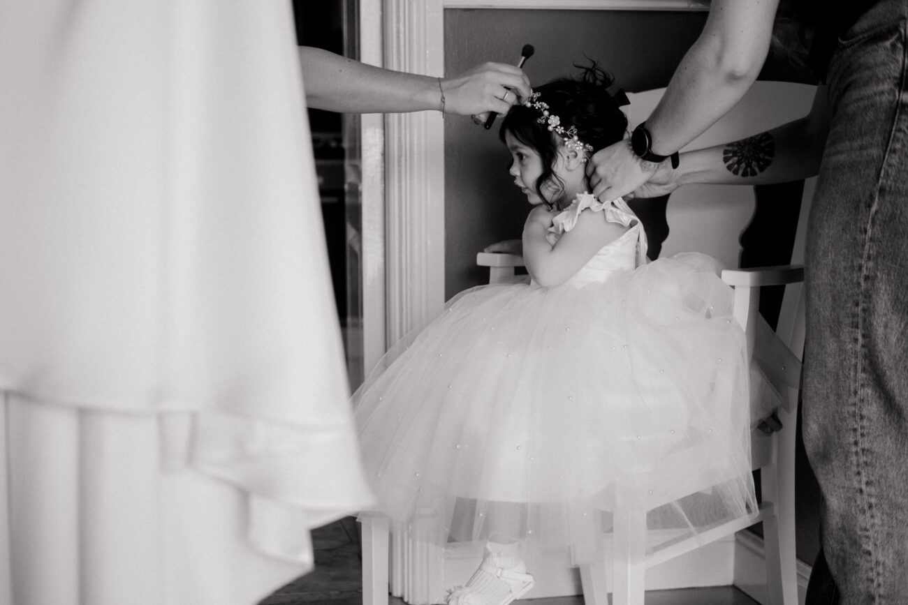 bridesmaids fixing flower girls hair at bridal prep in Kildare wedding