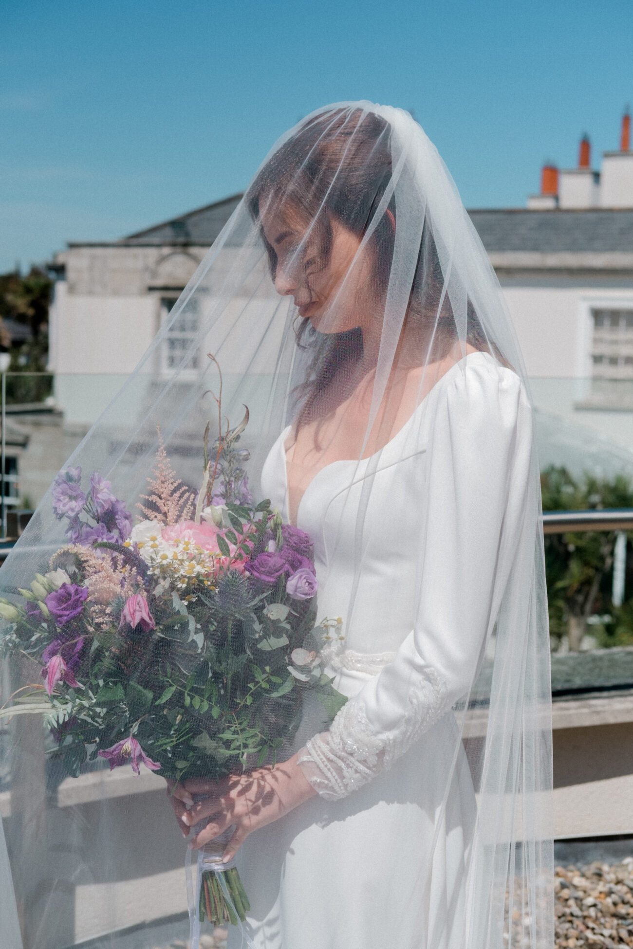 Bride outside in the sunshine during bridal prep at Portmarnock Resoert