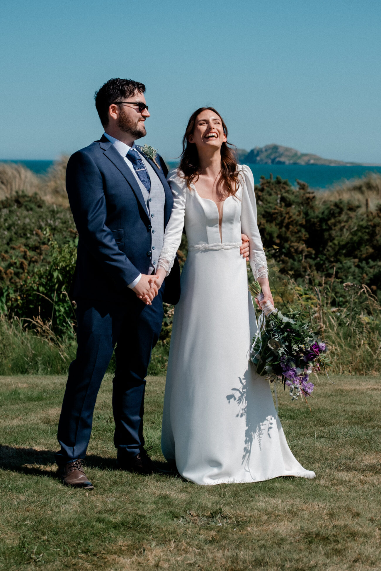 Wedding portrait locations at Portmarnock Resort, bride and groom at the front lawn